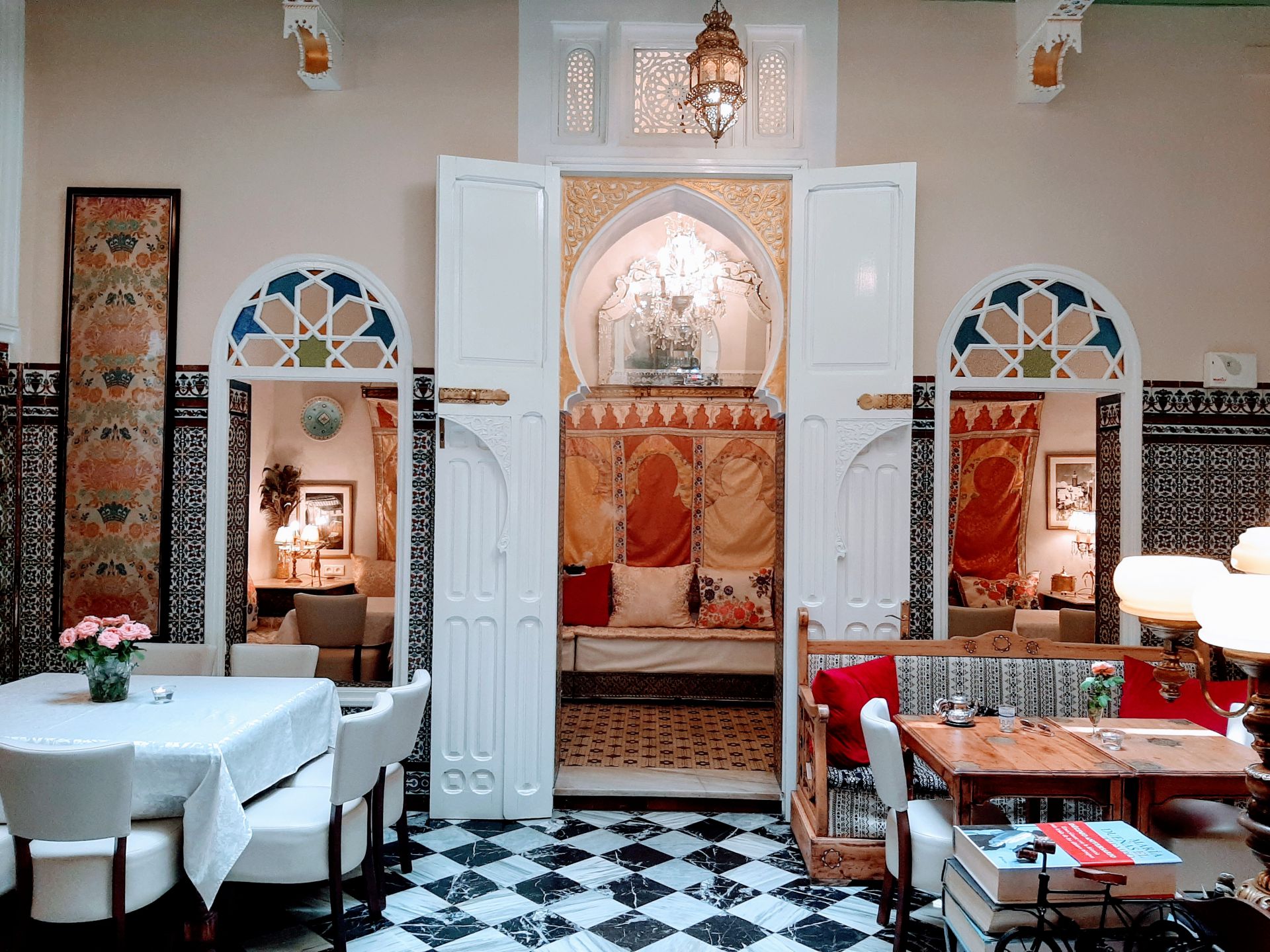 El Reducto — Salon with Moorish arches, zellige tiles and marble floor